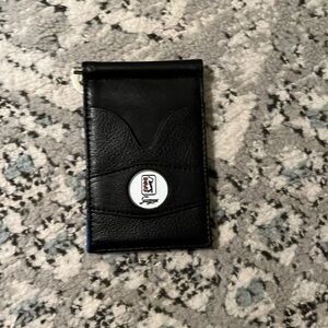 Black and blue wallet. Holds cash,cards,and change.